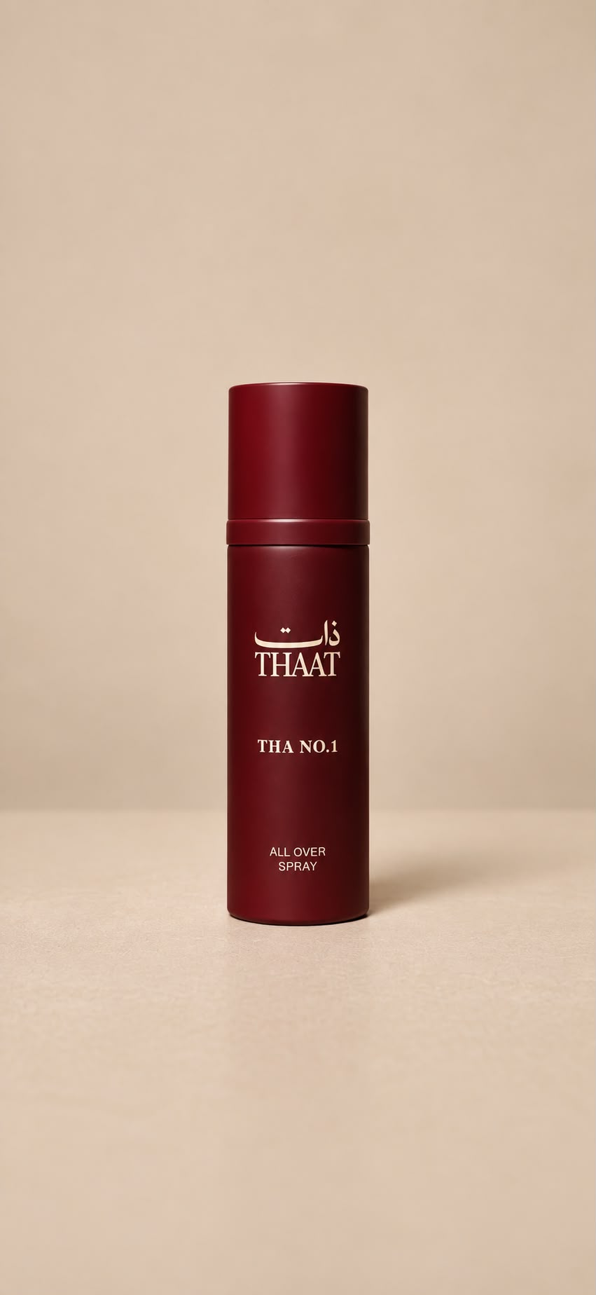 THA NO.1 من ذات — بخاخ All Over Spray بعبوة عنابية — خلفية بيج