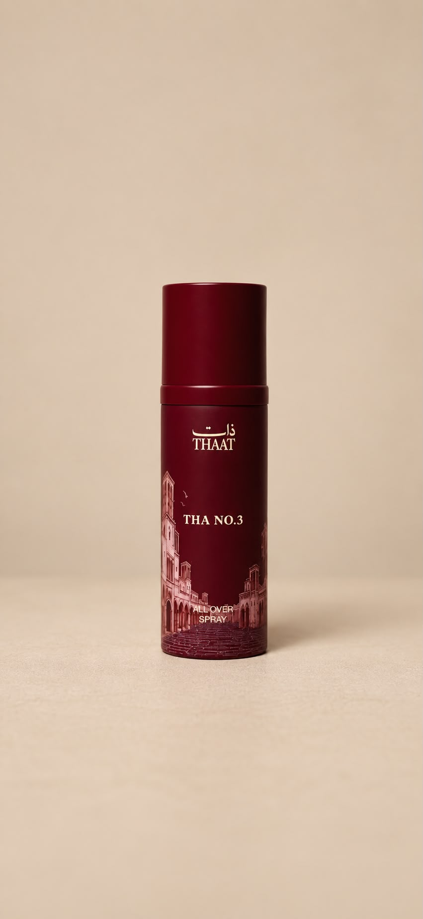 THA NO.3 من ذات — بخاخ All Over Spray بعبوة عنابية ونقوش معمارية — خلفية بيج